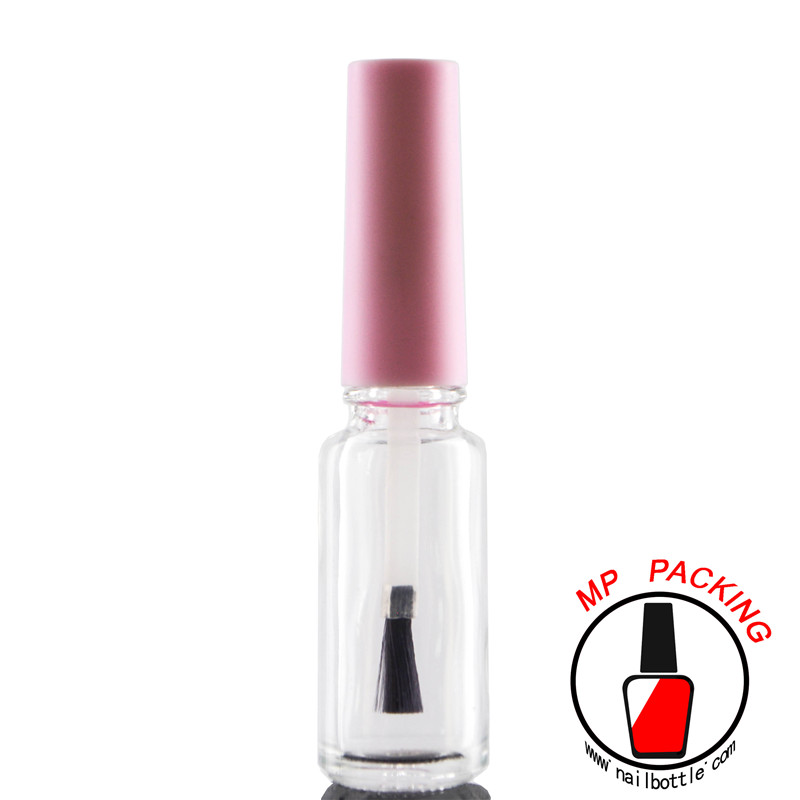 pink nail polish cap and bottle brush 