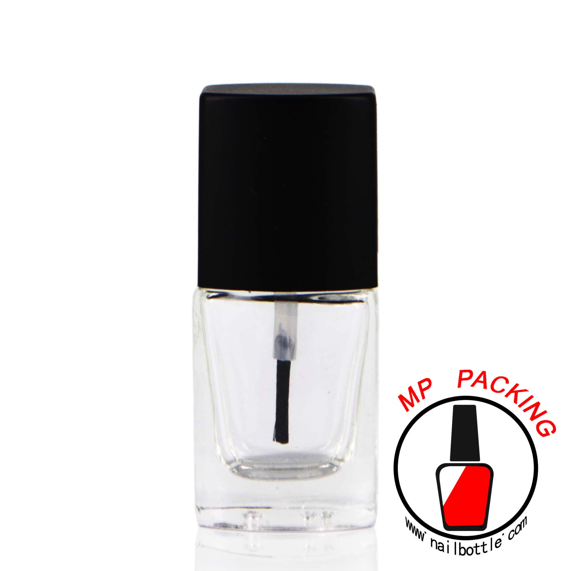 empty glass nail polish bottle with lids and brush 